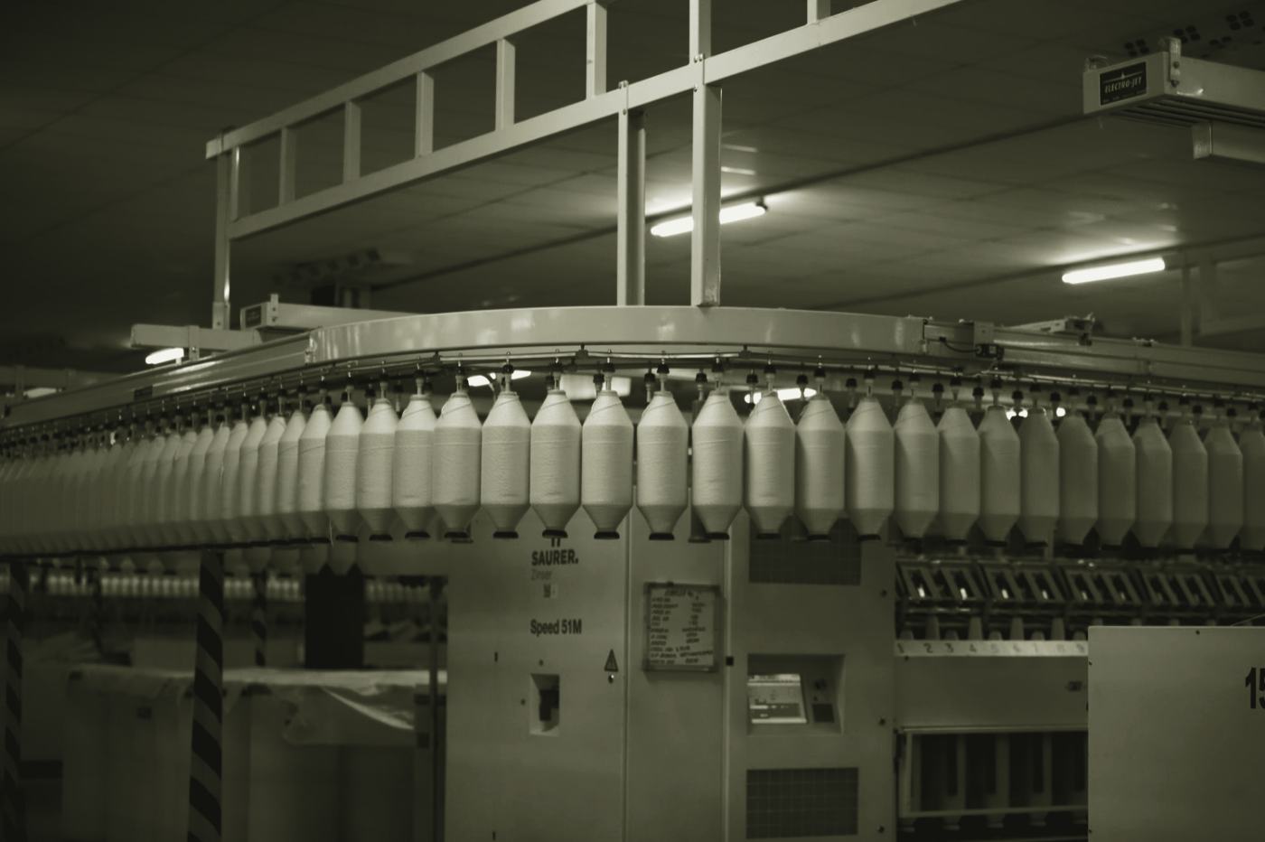 Yarn production line running in a textile mill, the kind of continuous operation Systain schedules