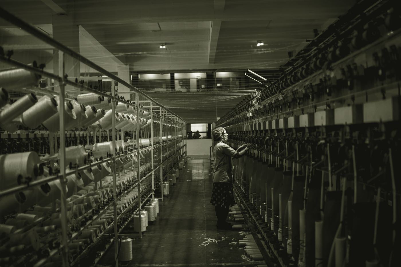 A plant operator monitoring machinery on the factory floor