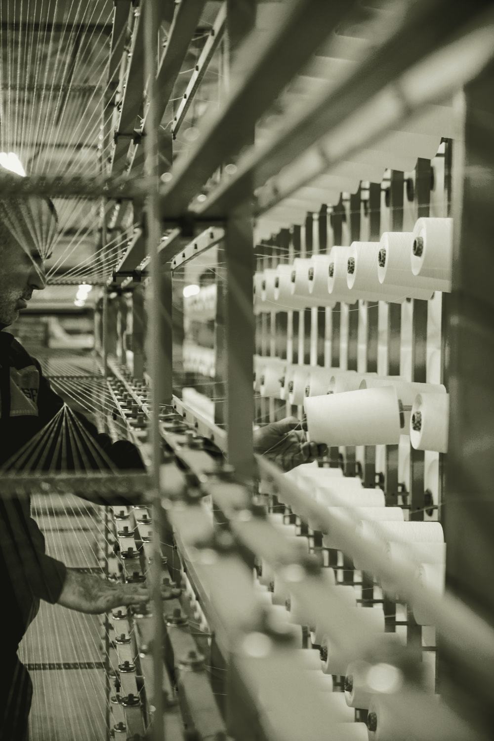 A machine operator working on a production line, the point where an expert system's decisions actually land